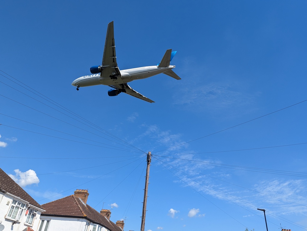 Plane over houses near Heathrow Airport